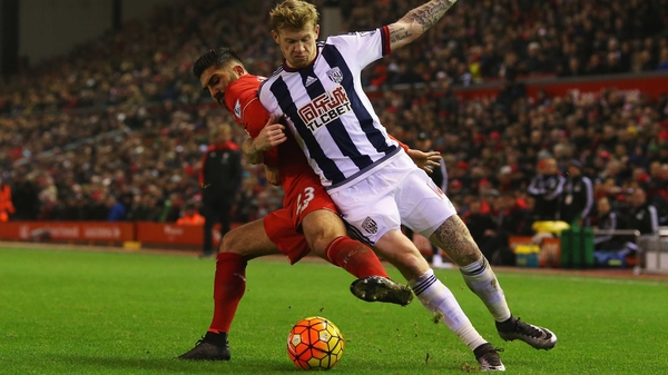 James McClean battles with Emre Can for possession at Anfield