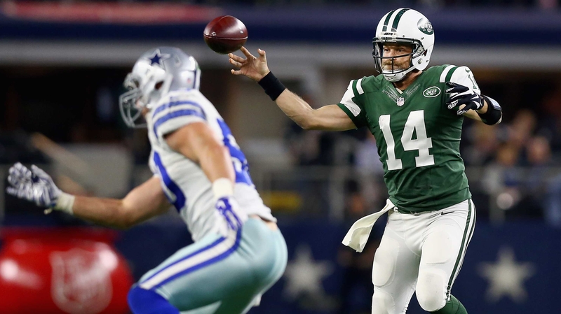 Ryan Fitzpatrick (No 14) of the New York Jets looks for an open receiver against the Dallas Cowboys