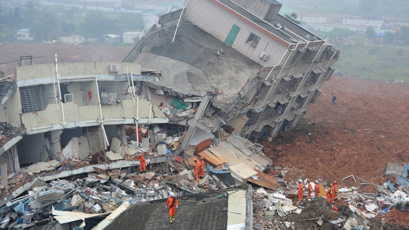 Rescuers look for survivors after a landslide hit an industrial park in Shenzhen, China