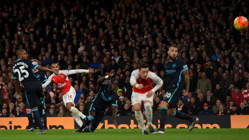 Theo Walcott scores Arsenal's opener against Manchester City