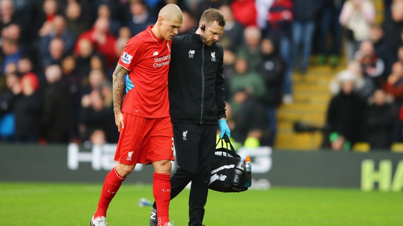 Martin Skrtel leaves the Vicarage Road pitch injured