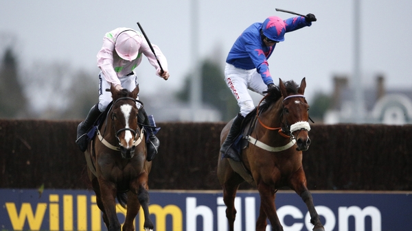 Vautour (l) and Cue Card (r) duel as they approach the finish at Kempton