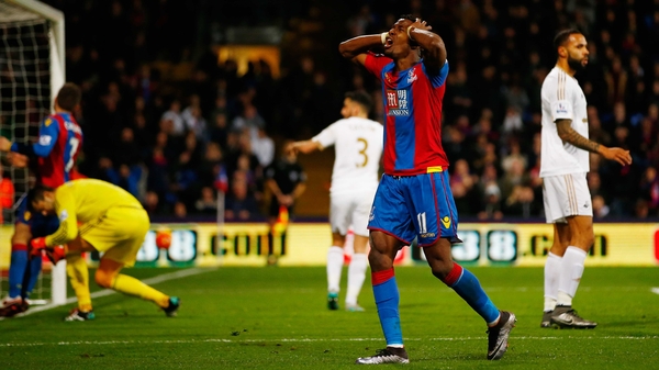 Wilfried Zaha reacts to a missed opportunity against Swansea