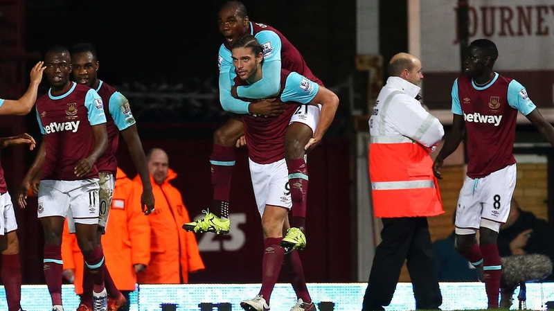 Andy Carroll celebrates heading the winner against Southampton