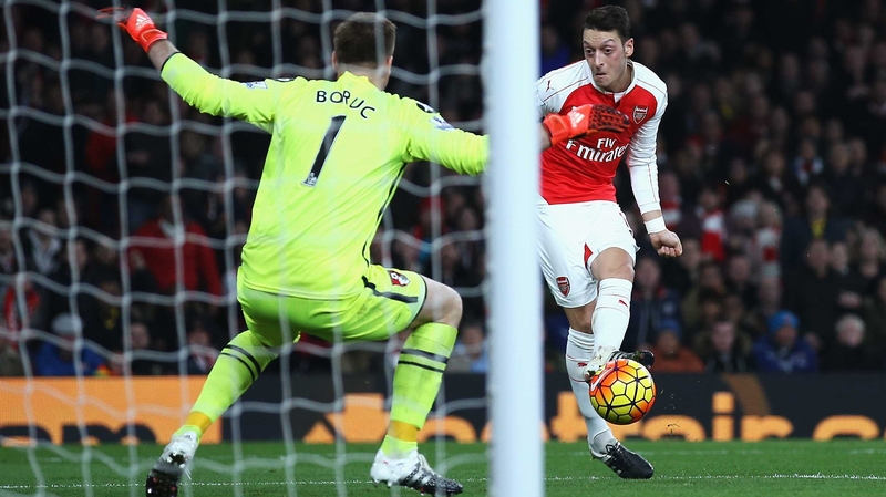Mesut Ozil stabs home against Bournemouth keeper Artur Boric