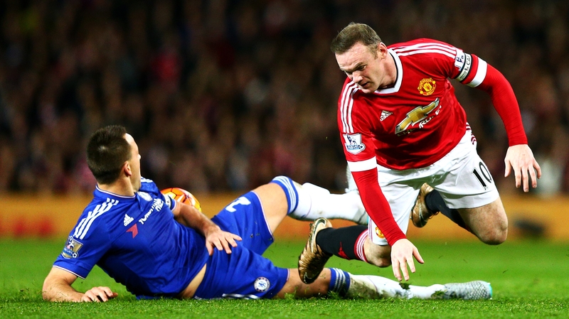 Wayne Rooney of Manchester United battles for the ball with John Terry of Chelsea