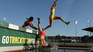 A competitor takes a dramatic tumble during the Women's 3,000 Metre Steeplechase at the USA Outdoor Track & Field Championships