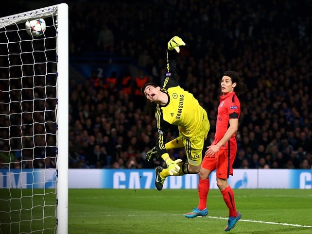 Goalkeeper Thibaut Courtois of Chelsea dives in vain as a
header from Thiago Silva (not seen) of PSG flies into his net