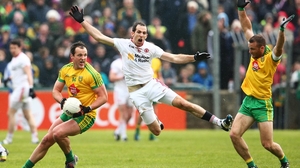 Donegal's Michael Murphy on the ball with Neil McGee and Justin McMahon in close attendance during the Ulster SFC preliminary round