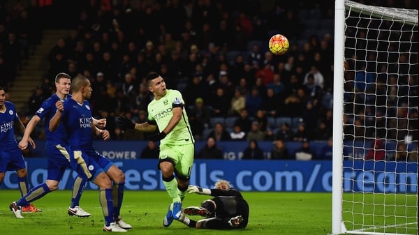 Sergio Aguero of Manchester City misses as goalkeeper Kasper Schmeichel of Leicester City attempts to block