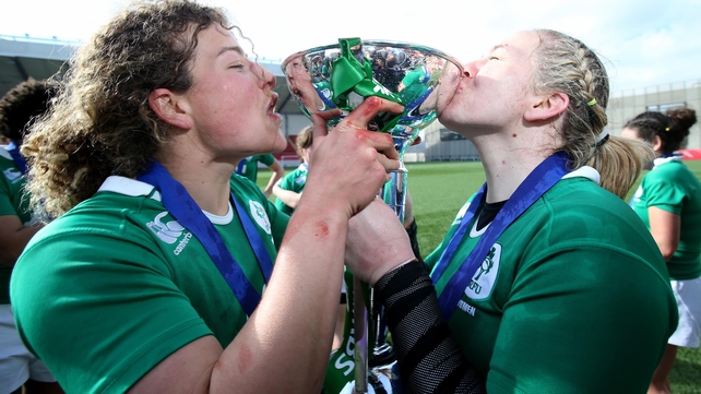 ...as did their female counterparts. Ireland's Jenny Murphy and captain Niamh Briggs celebrate with the trophy.