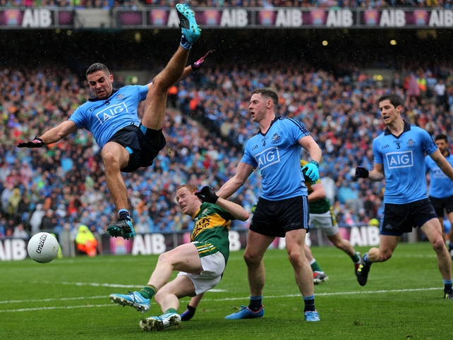 Dublin's James McCarthy takes a tumble after challenging Colm Cooper in the air in the All-Ireland final. The Dubs beat old rivals Kerry to reclaim Sam Maguire.