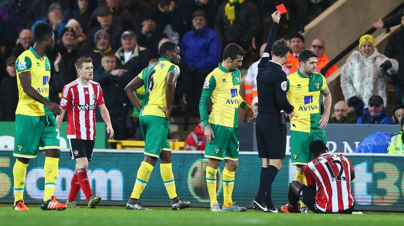 Victor Wanyama (R) was sent off against Norwich