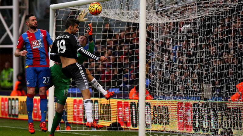 Diego Costa of Chelsea attempts to head the ball in past Wayne Hennessey of Crystal Palace