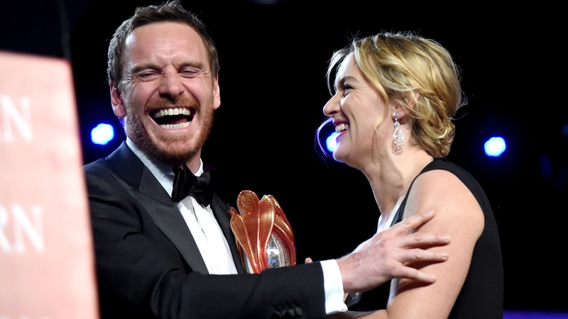 Michael Fassbender presented with the International Star Award by Kate Winslet