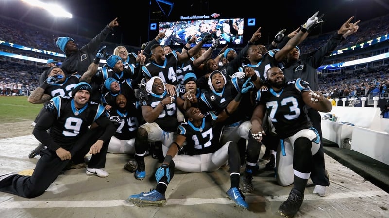The Carolina Panthers celebrate as they grabbed top seed in the NFC