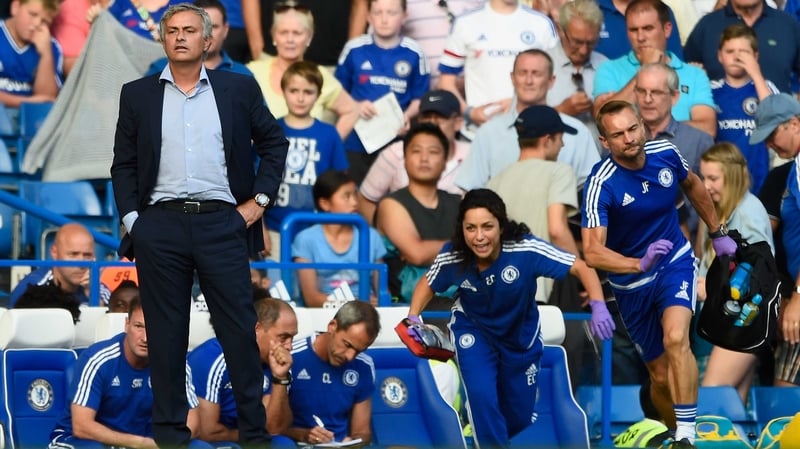 Eva Carneiro and Jon Fearn rise from the bench to treat Eden Hazard