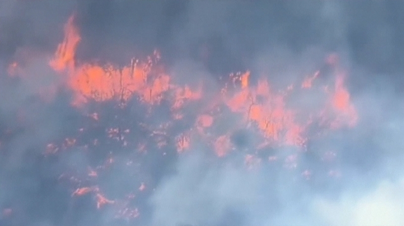 Fire fanned by strong winds doubled in size over 24hrs