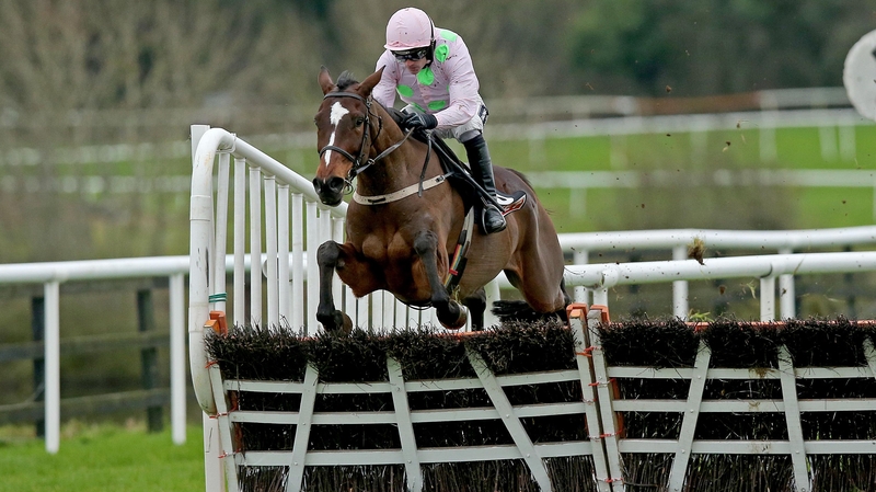 Ruby Walsh aboard Min as they clear the last at Punchestown on the way to a stylish win