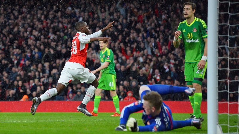 Joel Campbell wheels away in celebration after his leveller