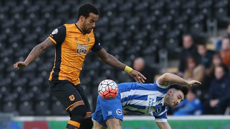 Tom Huddlestone challenges Richie Towell at the KC Stadium