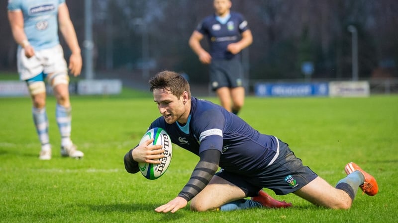 UCD's Billy Dardis scores their seventh try of their resounding won over Garryowen