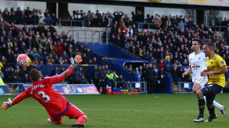 Kemar Roofe lifts the ball past goalkeeper Kristoffer Nordfeldt