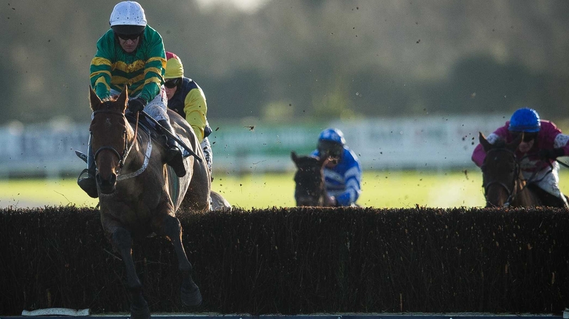 Nearly Nama'd ridden by Barry Geraghty clears the last fence on his way to victory