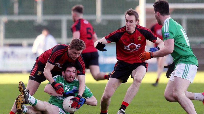 Down's Caolan Mooney with Fermanagh's Paddy McGovern