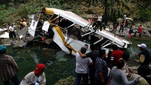 The Civil Protection Agency and family members help injured people after the crash in Veracruz, Mexico