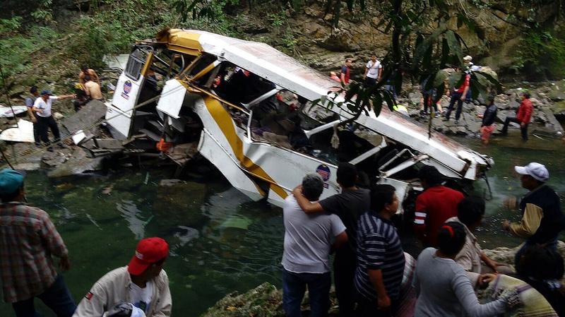 The Civil Protection Agency and family members help injured people after the crash in Veracruz, Mexico