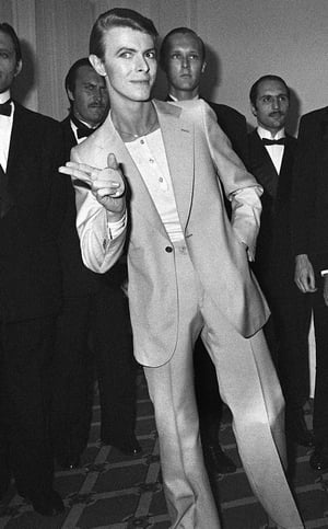 High-waisted, slim-fit suit and as usual, much cooler than his peers. 31st Cannes Film Festival, May, 1978