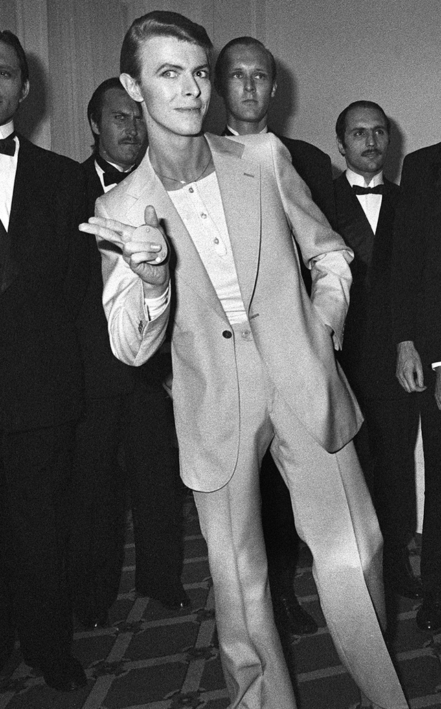 High-waisted, slim-fit suit and as usual, much cooler than his peers. 31st Cannes Film Festival, May, 1978
