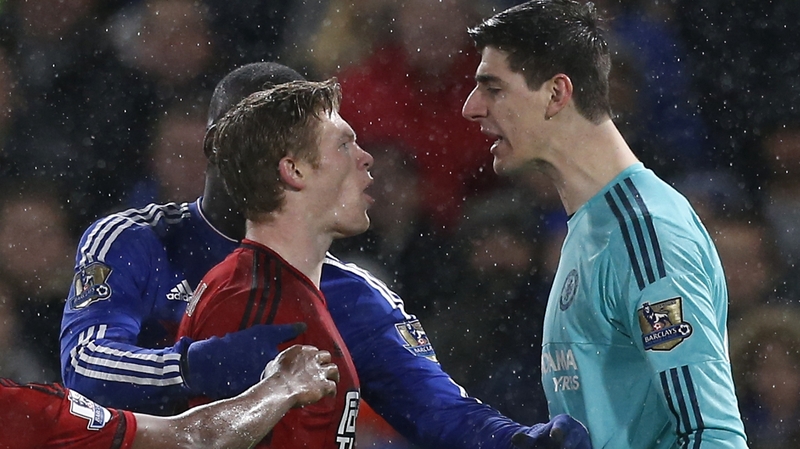 James McClean, seen here having a word with Chelsea's Thibaut Courtois, got WBA's late leveller