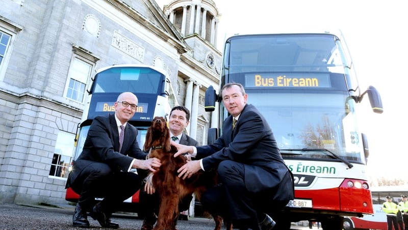 Paschal Donohoe (C) along with NTA Director of PTS Tim Gaston (L), Bus Éireann CEO Martin Nolan and red setter Teelin at the launch of the new buses