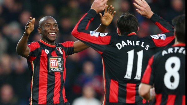 Benik Afobe (L) celebrates scoring Bournemouth's third goal with his team mate Charlie Daniels