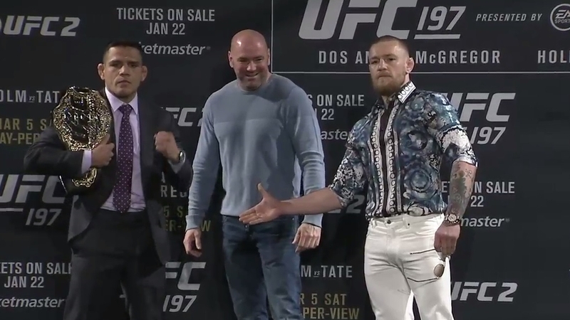 Rafael Dos Anjos (L) is reported to be out of his fight with Conor McGregor due to a foot injury