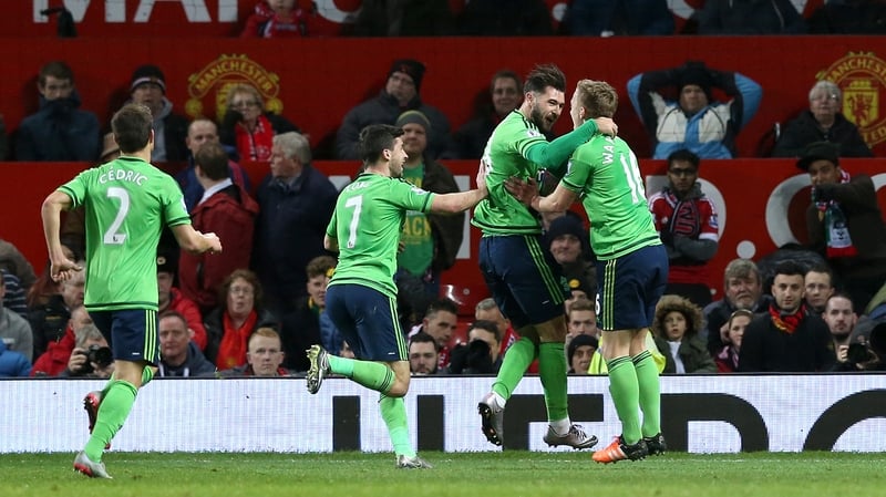 Charlie Austin and team-mates celebrate the winner