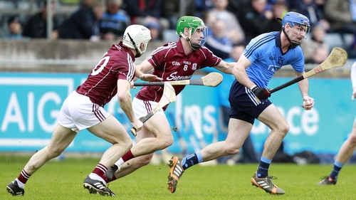 Daire Plunkett is chased by Galway's Greg Lally and Andy Smith