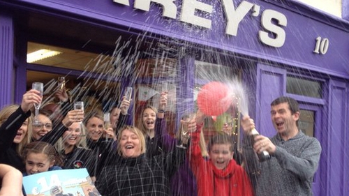Staff at Carey's Newsagents in Belmullet, Co Mayo, celebrate selling the winning ticket