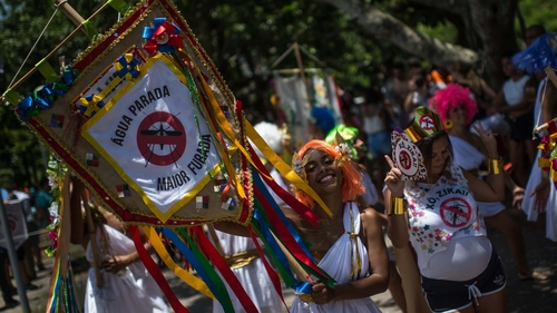 Revellers wearing Greek style costumes call for the prevention of the Zika virus in the first carnival on the streets of Rio de Janeiro yesterday