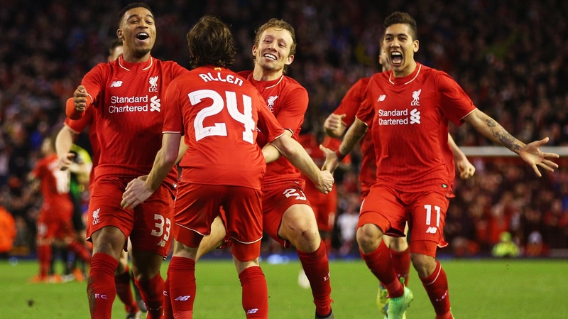 Joe Allen is congratulated by team mates after scoring the winning penalty