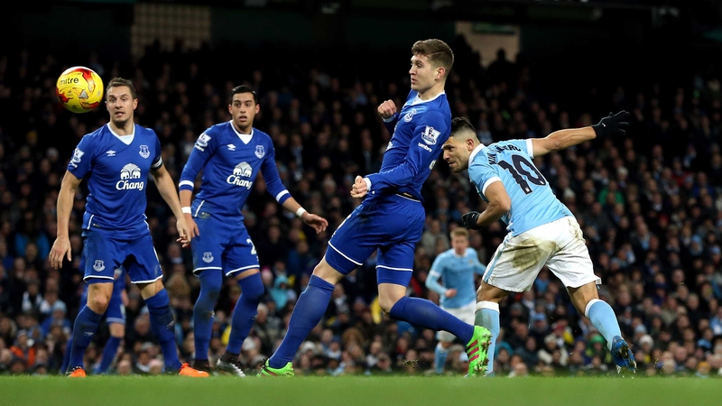 Sergio Aguero heads home the decisive goal at the Etihad