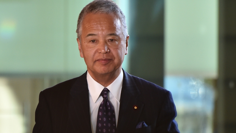 Japan's Economy Minister Akira Amari acknowledged taking money from a construction company executive