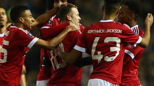 Wayne Rooney celebrates opening the scoring with his Manchester United team-mates