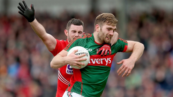 Cork's Noel Galvin challenges Aidan O'Shea of Mayo in last year's Division 1 encounter at Páirc Uí Rinn - a match which the hosts won