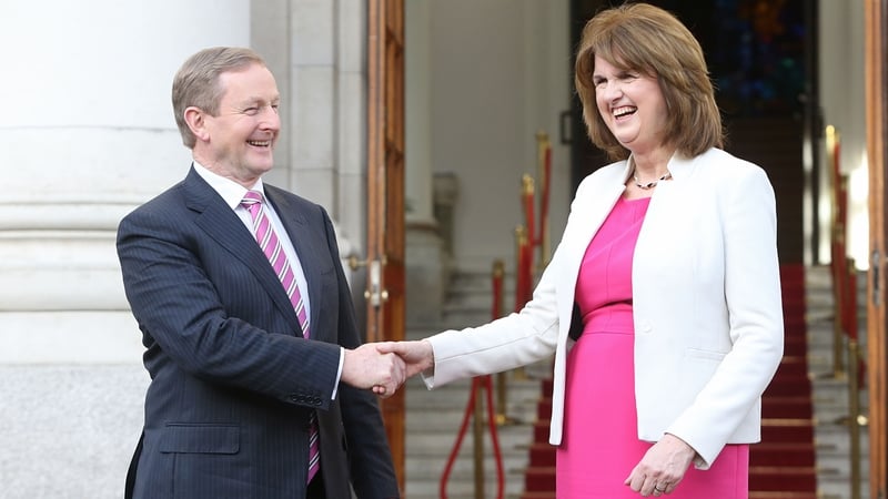 Enda Kenny and Joan Burton on the steps of Government Buildings