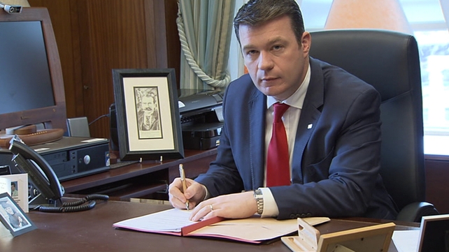Minister Kelly signs the Polling Day Order appointing February 26 as polling day