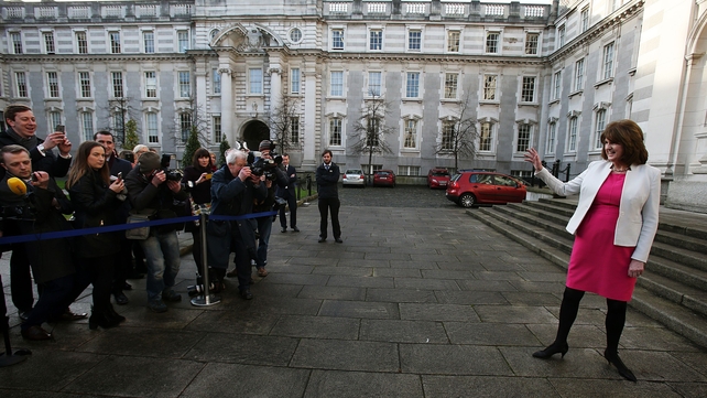 The Labour leader waves to the media at Government Buildings