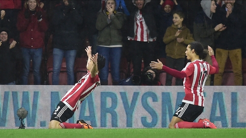 Maya Yoshida (L) celebrates with team mate Virgil van Dijk